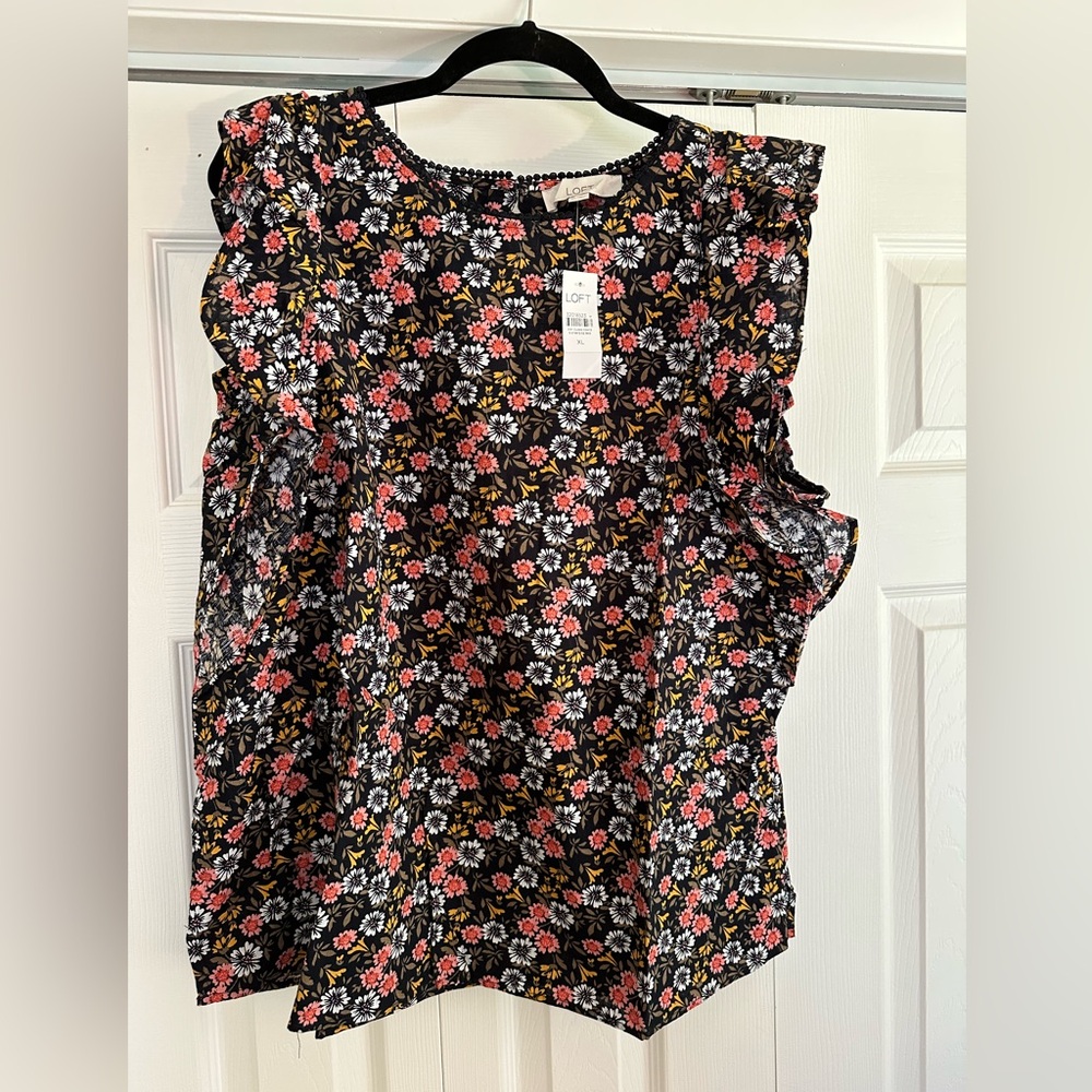 Loft ruffled sleeveless top with keyhole opening on back.